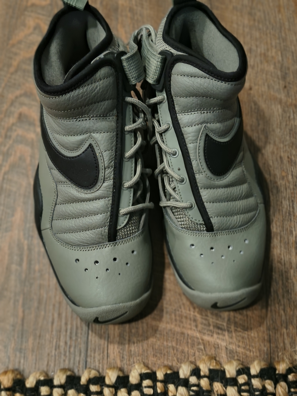 Nike Air Shake Ndestrukt sneakers in a dark stucco green colorway with a promine